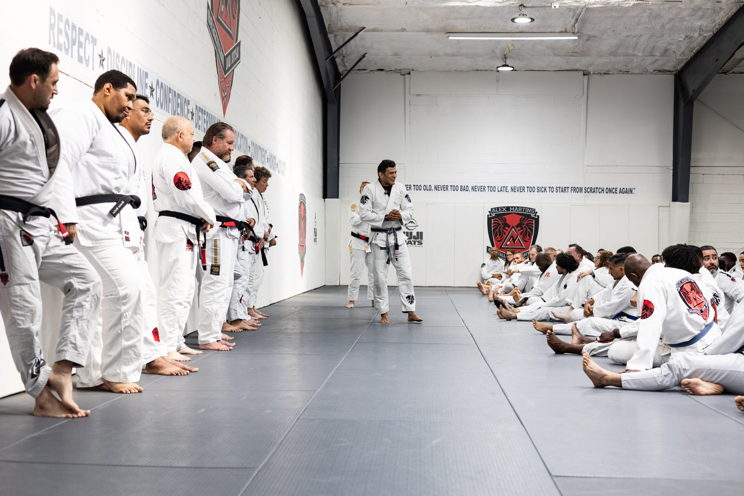 Dallas BJJ students practicing fundamental guard passes on clean academy mats at Alex Martins BJJ.